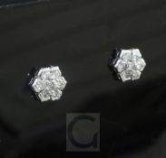 A pair of 18ct white gold and diamond cluster hexagonal ear studs, each set with seven round cut