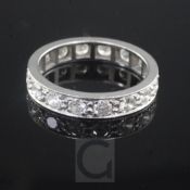 A platinum and diamond full eternity ring, set with sixteen round brilliant cut stones, size M.