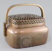 A large Chinese copper alloy hand warmer, 17th / 18th century, the front engraved and chased with