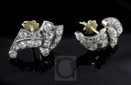A pair of early 20th century white gold and diamond cluster ear studs, of free form design.