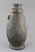 A Chinese archaic bronze ritual drinking vessel and cover, Hu, Western Zhou dynasty, 11th-9th