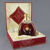 A boxed Louis XIII de Remy Martin Grande Champagne Cognac in a Baccarat Crystal decanter.