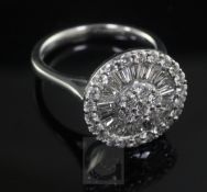 A modern 18ct white gold and diamond cluster dress ring, of circular form and set with brilliants