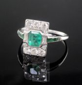 A 1930's Art Deco platinum and diamond set tablet ring, of rectangular form, the central emerald (