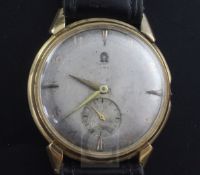 A gentleman's late 1940's yellow metal Omega automatic wrist watch with Arabic and baton dial and