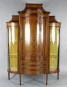 An Edwardian marquetry inlaid bowfronted china display cabinet, in the manner of Edwards & Roberts