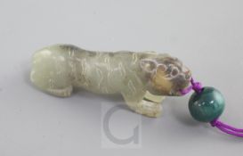 A Chinese celadon and black jade figure of a crouching tiger, Song dynasty style and possibly of the