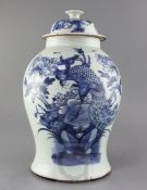 A Chinese blue and white "phoenix and peony" vase and cover, 19th century, the bird depicted amid