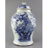 A Chinese blue and white "phoenix and peony" vase and cover, 19th century, the bird depicted amid