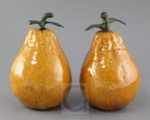 A pair of Chinese Canton pottery large models of persimmon fruit, late 19th century, of ochre colour