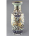 A large Chinese celadon ground baluster vase, mid 19th century, moulded and decorated in