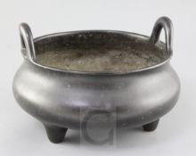 A large Chinese bronze ding censer, Xuande mark, probably 19th century, the rim set with a pair of