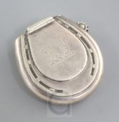 A Victorian silver horse shoe shaped vesta case by Thomas William Dee, with engraved crest and