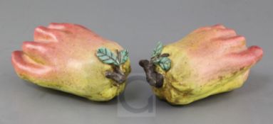 A pair of Chinese enamelled porcelain models of finger citrons, 19th century, applied with leaf