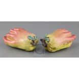 A pair of Chinese enamelled porcelain models of finger citrons, 19th century, applied with leaf