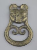 A Chinese archaic bronze tiger-mask harness plaque, probably Han dynasty, 2nd century B.C. - 2nd