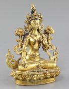 A Tibetan gilt bronze seated figure of White Tara, flanked by lotus buds and seated on a lotus