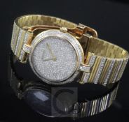 A Cartier special edition 18ct two colour gold and diamond set quartz wrist watch, with pave set