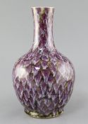 A Chinese purple splashed porcelain bottle vase, 19th century, decorated in imitation of Jun