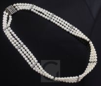 A 1920's/1930's three row cultured pearl and diamond set choker necklace, with diamond set clasp and