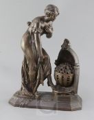 Julien Caussé (1869-1914). A bronze figure of an elegant lady warming her feet beside a brazier,