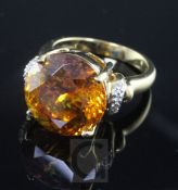 A modern 18ct gold and spheralite dress ring, with diamond set shoulders, size N.