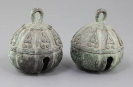 A pair of Chinese bronze bells, possibly Tang dynasty, brown patina with heavy malachite