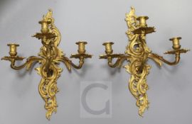 A pair of late 19th century French ormolu three branch wall lights, height 19.5in.