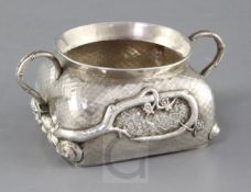 A late 19th/early 20th Japanese planished silver two handled sugar bowl, of squat form and decorated