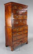An early 18th century walnut chest on chest, fitted three short over seven long drawers, the base
