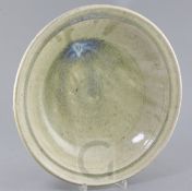 A Chinese green Jun ware style dish, probably 17th / 18th century, with a crackle to the deep glaze,