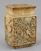 A Chinese soapstone vase, Fanghu, Qing dynasty, carved in relief with a horned beast amid clouds,