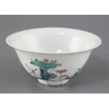 A Japanese Kakiemon style bowl, probably 18th / 19th century, the interior painted with butterflies,