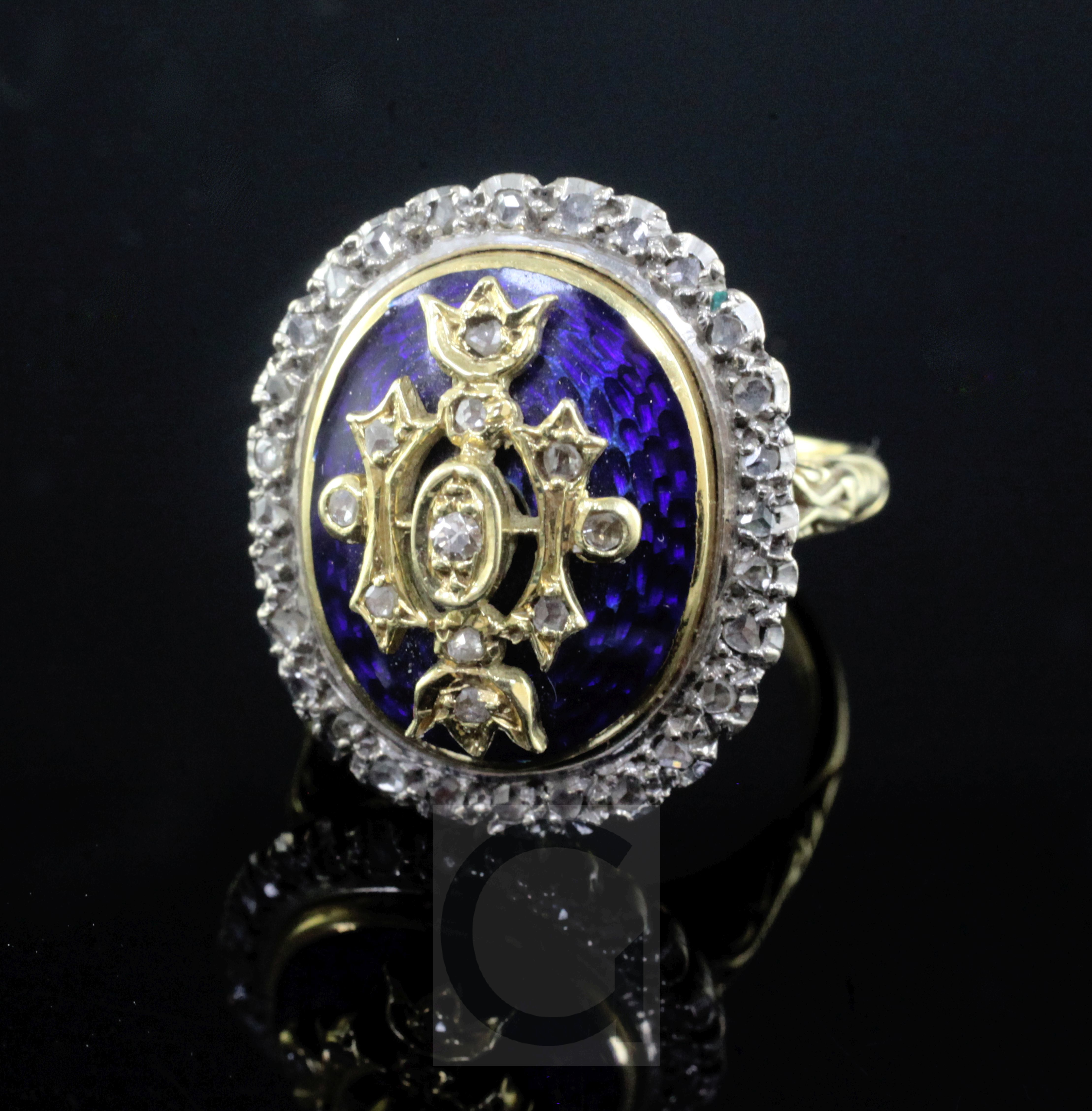 A 1980's George III style 18ct gold, blue enamel and diamond set dress ring, with carved