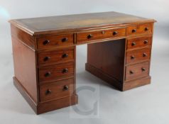 An early Victorian mahogany pedestal desk, with tooled skiver and central S.Mordan & Co drawer