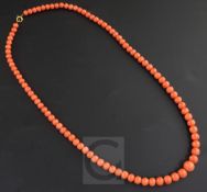 A 1920's single strand graduated coral bead necklace, with 9ct gold clasp, in original Boodle &