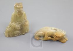 Two Chinese soapstone figures, 19th century, the first of a recumbent mythical beast, the second a