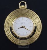 A Hermes World Time gilt brass pocket watch.