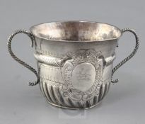 A William III silver porringer by John Cory, with engraved decoration and ropetwist girdle and