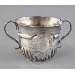 A William III silver porringer by John Cory, with engraved decoration and ropetwist girdle and