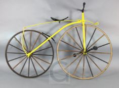 A wrought iron and ash model of a Michaux Velocipede bicycle, c.1865, with bright yellow painted