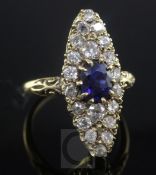 An 18ct gold marquise shaped sapphire and diamond dress ring, size N.