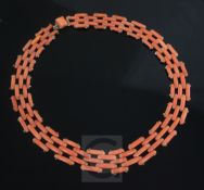 A gold and coral gate link choker necklace, 37cm.