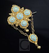 An early 20th century Indian? high carat gold and turquoise set drop brooch, of quatrefoil design