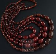 Three assorted simulated cherry amber graduated bead necklaces and one other necklace, gross