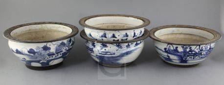 Four Chinese blue and white bowls, 19th century, each painted with fishermen in a river landscape