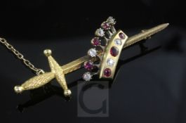 An early 20th century gold, ruby and diamond set coronet and sword brooch, in Goldsmiths &