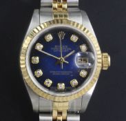 A lady's 18ct gold and steel Rolex Oyster Perpetual Datejust wrist watch with diamond set numerals