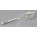 A George III silver fish slice, with loaded demi reeded silver handle, Henry Chawner, London,