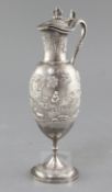 A late 19th century Indian silver pedestal ewer by Dass & Dutt, Bhowanipore, Calcutta, with vase